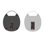 The underneath of two Cinoart PTB FI Coffee tampers, shown side by side on a white background. The left is black and the right is white. Both show unit specifications labels. 
