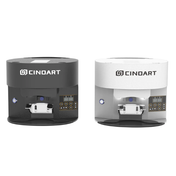 Two Cinoart cylindrical countertop cafe automatic coffee tamper machines shown side by side on a plain white background, one in black and one in white, both with front control panels and the CINOART logo visible on top.