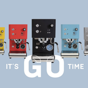 Profitec GO 2.0 home espresso machines in different colours on a light background.