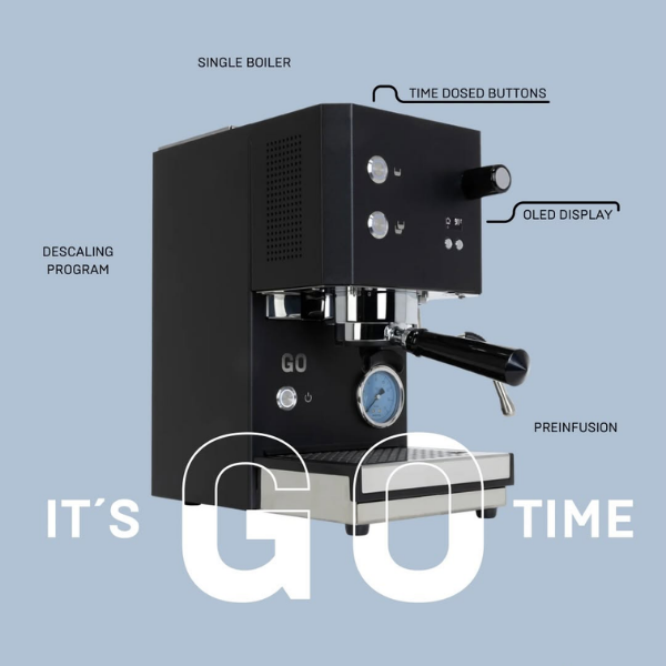 A black espresso machine with overlaid feature callouts reading SINGLE BOILER, TIME Dosed BUTTONS, OLED DISPLAY, DESCALING PROGRAM, and PREINFUSION, plus large white text reading IT'S GO TIME on a light blue background.