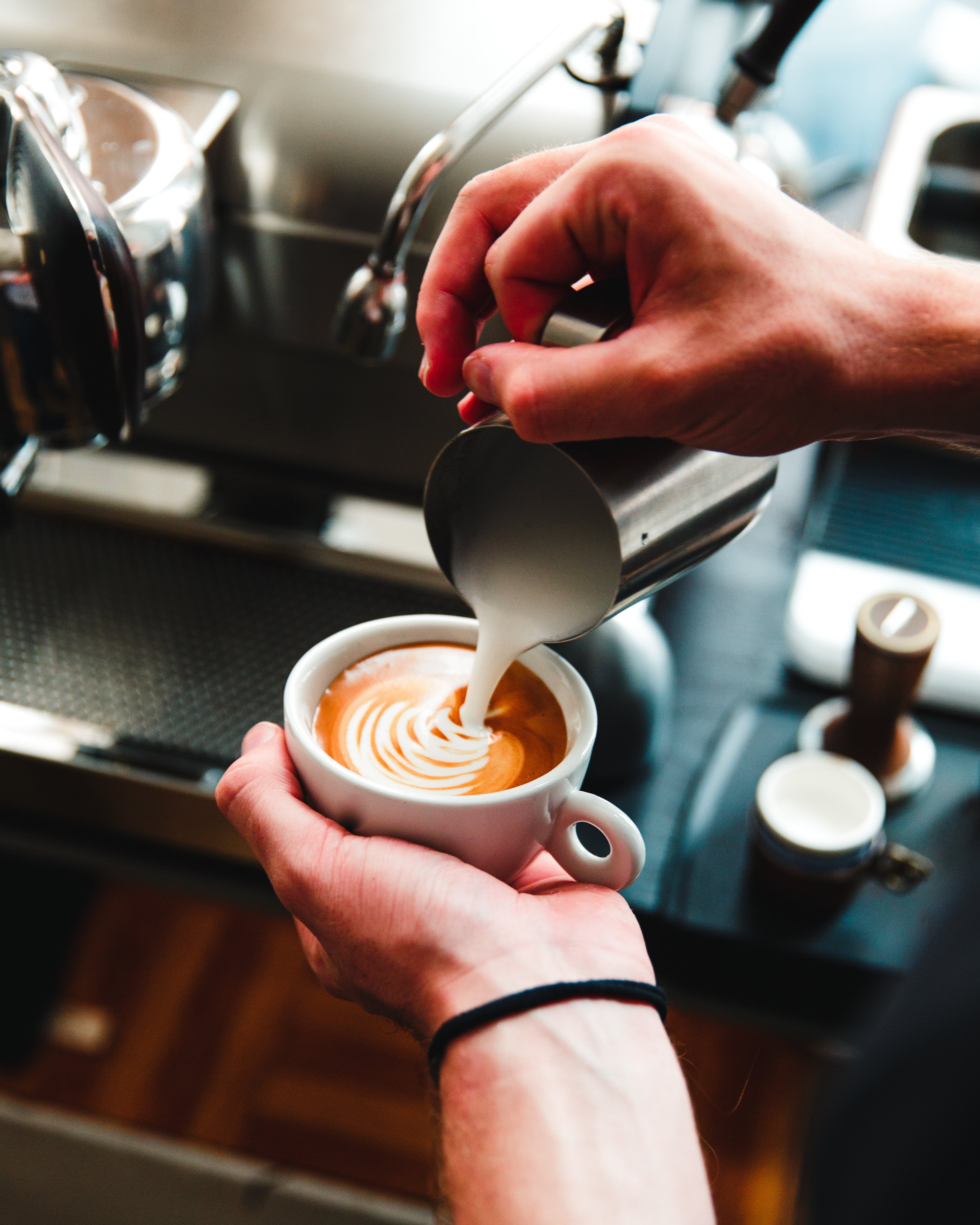 barista-pours-steamed-milk-on-espresso.jpg